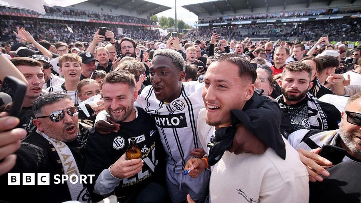 Agroup celebrating with players after a match