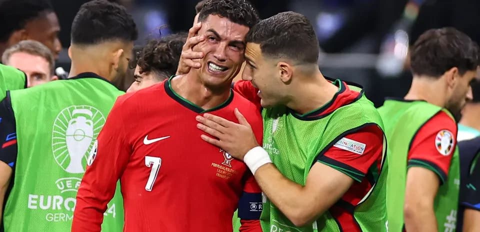 Cristiano Ronaldo celebrating with teammate after match