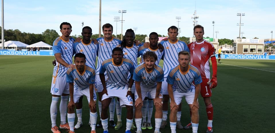 Equipo de Sporting JAX posando para la foto