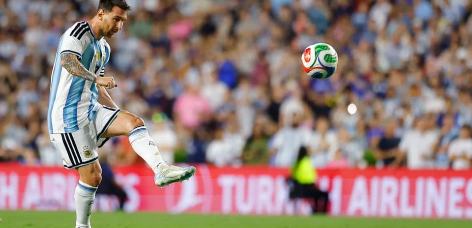 Lionel Messi kicking the ball during a match