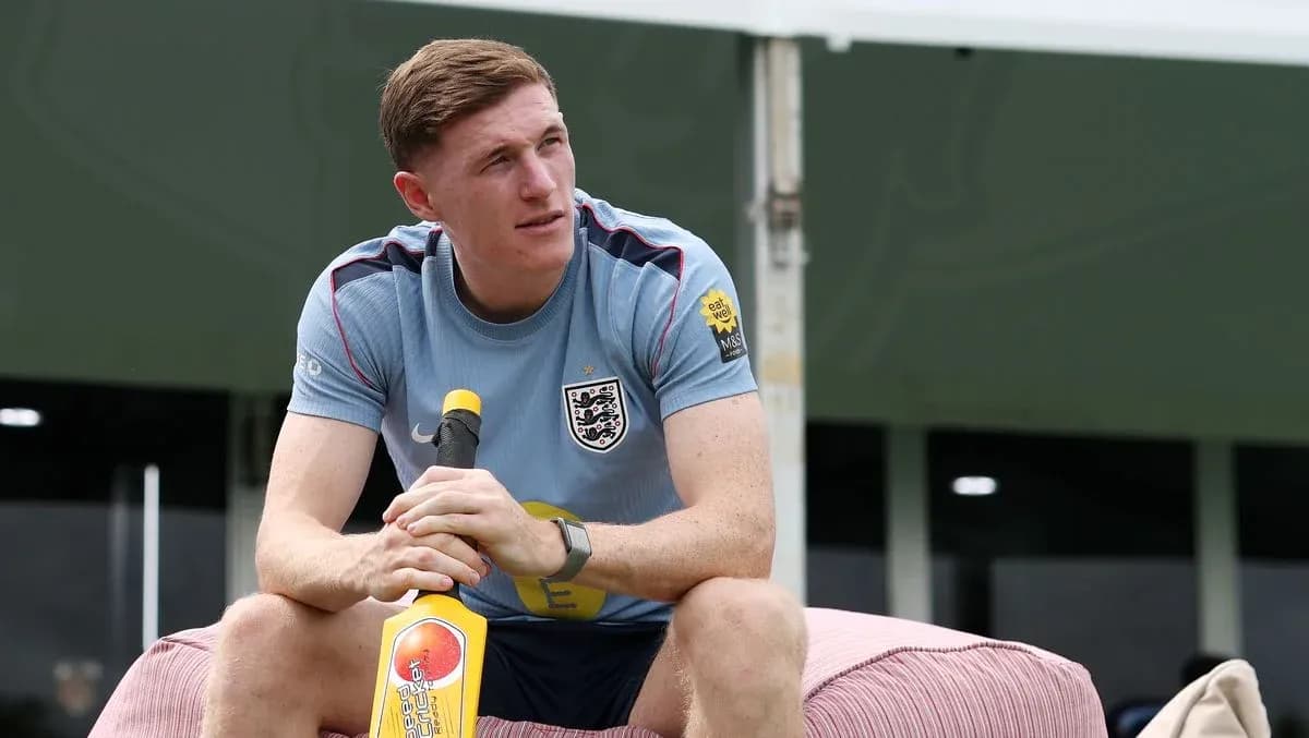 Jugador sentado con bate de cricket en entrenamiento