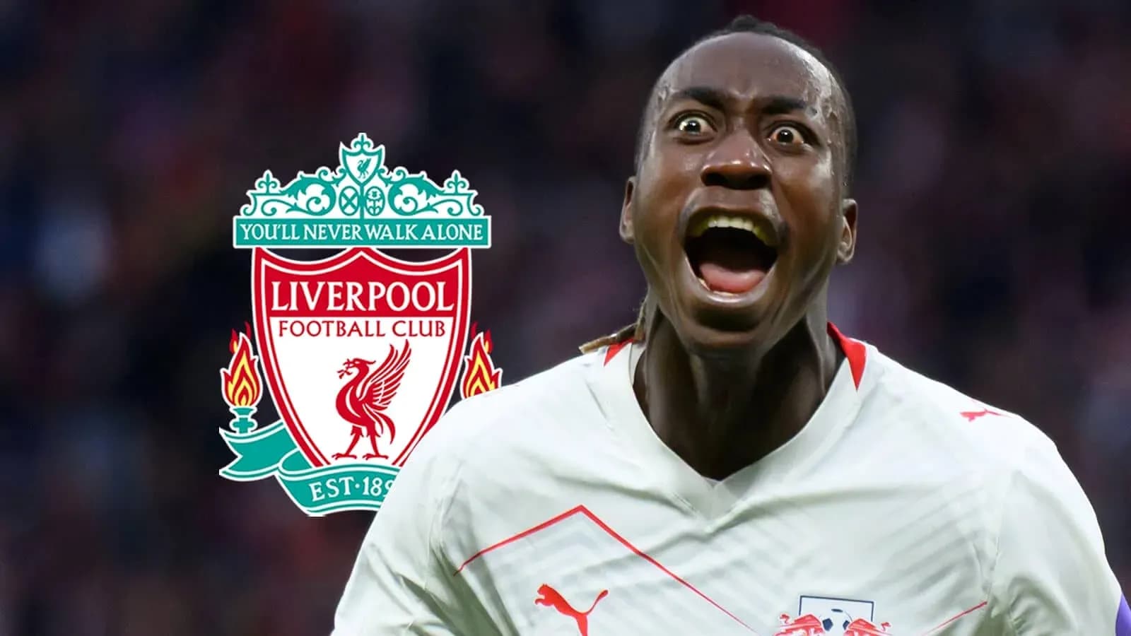 Jugador celebrando con el escudo del Liverpool de fondo